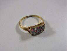 An 18ct gold ruby and diamond ring, size O.