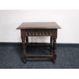 A classical style oak coffin stool