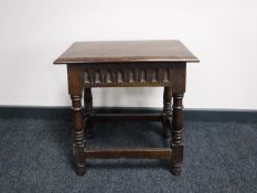 A classical style oak coffin stool