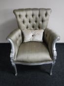 A silvered framed scroll arm armchair,