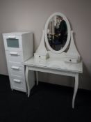 A white dressing table with oval mirror,