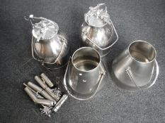 Four stainless steel pressurised churns (two with lids) and basket of accessories