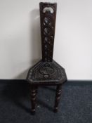 A carved spinning chair