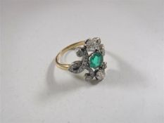 An 18ct gold emerald and diamond Art Nouveau style ring, size M/N.