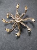 A carved oak eight branch chandelier