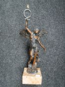 A patinated metal figure of winged goddess Nike, on marble base,