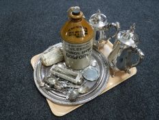 A tray of assorted plated wares including tea and coffee pot, serving trays, tea spoons,