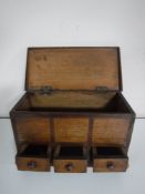 An Edwardian oak miniature chest fitted three drawers