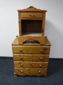 A pine four drawer chest together with a pine bedside stand,