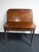 A George III mahogany foldover tea table