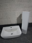 A bathroom sink with pedestal