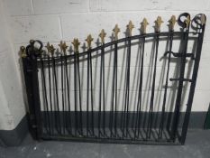 A pair of wrought iron gates CONDITION REPORT: These are each 148cm in length.