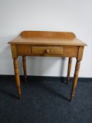An antique pine hall table fitted a drawer