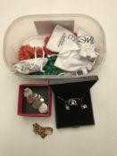 A box of costume jewellery, green stone necklace, dress ring, necklace and earrings etc.