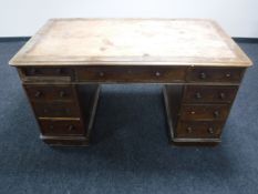 A Victorian mahogany nine drawer desk