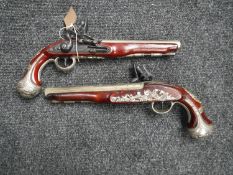 A pair of replica flintlock pistols