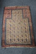 An antique fringed Persian prayer rug