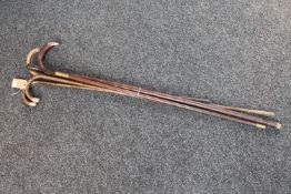 Five antique walking sticks (four with silver mounts)