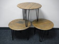 Three oak barrel topped coffee tables on metal legs