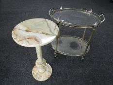 A circular green onyx plant stand together with an oval metal two tier trolley with lift off