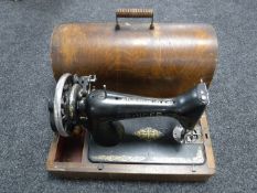 A mid 20th century cased Singer hand sewing machine