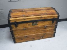 An antique pine metal bound shipping trunk