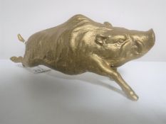 A gilt metal figure of a boar
