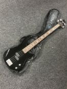 A Lindo electric bass guitar in carry bag