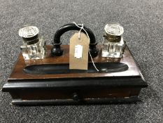 An Edwardian desk stand with two ink wells