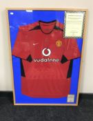 A Manchester United home shirt signed by Ruud Van Nistelrooy,