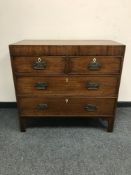 A George III mahogany chest of four drawers,