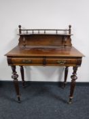 A nineteenth century mahogany writing table fitted with two drawers,