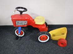 A vintage Rolly toys tractor with trailer