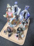 A tray of seven oriental pottery figures
