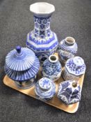 A tray of blue and white oriental porcelain including vases, lidded storage jar,