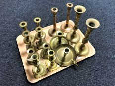 Six pairs of brass candlesticks together with two chambersticks