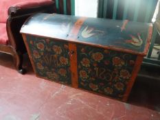 A nineteenth century hand painted dome topped shipping trunk
