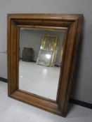 A contemporary pine framed overmantel mirror