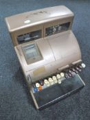 A mid twentieth century cash register with key