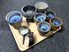 A tray of continental glazed pottery pedestal bowls,