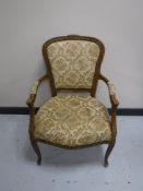 A Continental walnut salon chair with tapestry seat,