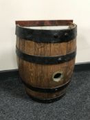 An oak coopered barrel stick stand