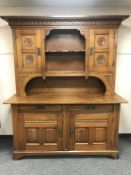 A late nineteenth century carved oak dresser,