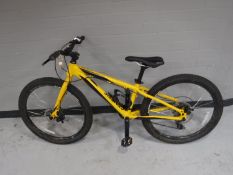 A boy's Genesis Core 24 mountain bike