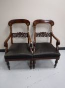 A pair of Continental mahogany scroll arm chairs, width 54 cm.