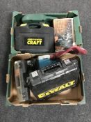 A box of Karcher pressure washer and a Stihl electric chain saw