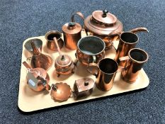 A tray of continental copper wares including teapot, cauldron, wine funnel,