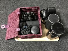 A tray of Nikon F-301 camera with lens in case, basket of Nikon Em camera,