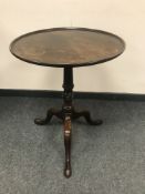 A nineteenth century mahogany circular tripod occasional table,