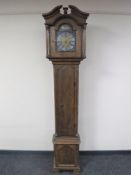 A continental oak cased longcase clock with pendulum and weights